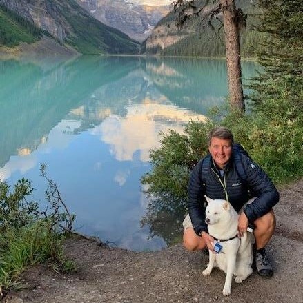 Malamute with human at Lake Louis
